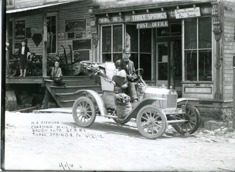 M.A. Detwiler, rural mail carrier, in Brush automobile in front of Three Springs post office. Used in "Second Century," page 34.
[A John A. Stevens negative. He was postmaster.]